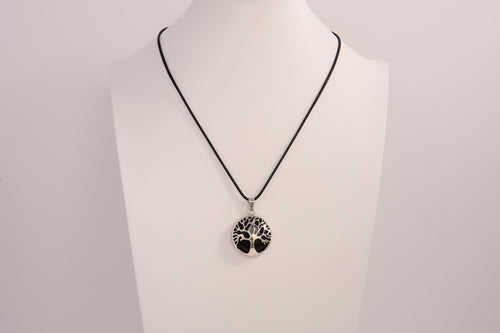 Raw Earth Crystals obsidian pendant featuring a tree of life design, crafted with natural black obsidian and sterling silver, promoting grounding, protection, and spiritual clarity.