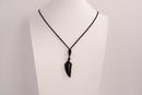 Raw Earth Crystals obsidian point pendant necklace featuring natural crystal jewelry designed for protection, grounding, and emotional healing.