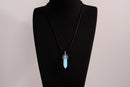 Raw Earth Crystals opalite necklace with a pointed natural stone pendant, designed to promote emotional balance, enhance clarity, and support spiritual awareness.