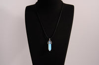 Raw Earth Crystals opalite necklace with a pointed natural stone pendant, designed to promote emotional balance, enhance clarity, and support spiritual awareness.