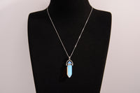 Raw Earth Crystals opalite necklace featuring a pointed natural stone pendant, designed to enhance emotional balance, promote clarity, and support spiritual connection.