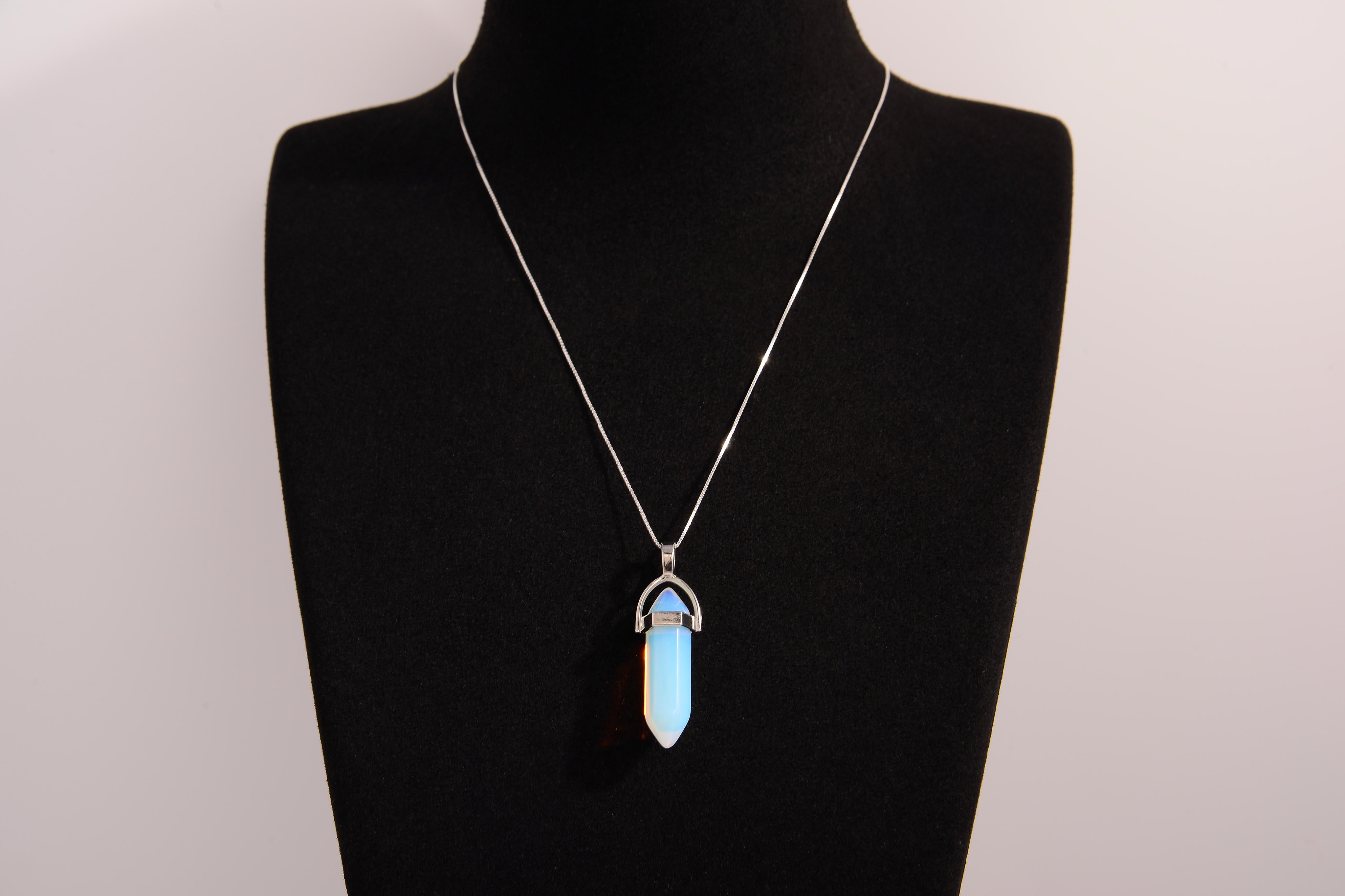 Raw Earth Crystals opalite necklace featuring a pointed natural stone pendant, designed to enhance emotional balance, promote clarity, and support spiritual connection.