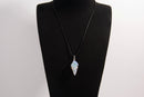 Raw Earth Crystals opalite pendant with a spiral wire wrap design, crafted from natural stone to promote emotional balance, calmness, and inner peace.