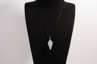 Raw Earth Crystals opalite pendant with a spiral wire wrap design, crafted from natural stone to promote emotional balance, calmness, and inner peace.