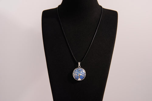 Raw Earth Crystals opalite pendant featuring a tree of life design, crafted with natural crystal for emotional healing, calmness, and spiritual growth.