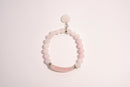 Raw Earth Crystals pink rose quartz bracelet with raw stone accent, crafted from natural crystal, promotes love, compassion, and emotional healing.