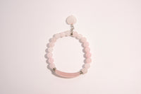 Raw Earth Crystals pink rose quartz bracelet with raw stone accent, crafted from natural crystal, promotes love, compassion, and emotional healing.