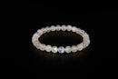 Rainbow moonstone beaded bracelet from Raw Earth Crystals, featuring natural gemstones with iridescent glow for intuition, emotional healing, and spiritual clarity.
