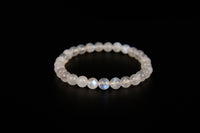 Rainbow moonstone beaded bracelet from Raw Earth Crystals, featuring natural gemstones with iridescent glow for intuition, emotional healing, and spiritual clarity.