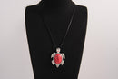 Raw Earth Crystals red howlite turtle necklace crafted from natural stone to support calm focus, stress relief, and emotional grounding.