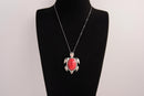Raw Earth Crystals red howlite turtle necklace crafted from natural stone to support calm focus, stress relief, and emotional grounding.