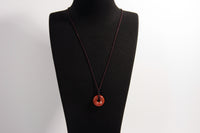 Raw Earth Crystals red jasper disc pendant necklace crafted from natural crystal for strength, grounding, and vitality.