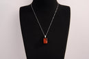 Raw Earth Crystals red jasper rectangle pendant necklace featuring natural crystal jewelry designed for grounding, strength, and emotional stability.