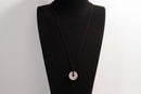Raw Earth Crystals rose quartz disc pendant necklace crafted from natural crystal for love, compassion, and emotional healing.