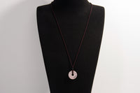 Raw Earth Crystals rose quartz disc pendant necklace crafted from natural crystal for love, compassion, and emotional healing.