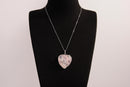 Raw Earth Crystals rose quartz heart pendant with an elegant rose design, featuring a soft pink rose quartz stone and a silver-tone vine with leaves, promoting love, compassion, and emotional healing.