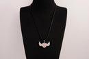 Raw Earth Crystals rose quartz heart with wings necklace, featuring a soft pink heart-shaped stone adorned with delicate angelic wings, designed to enhance love, compassion, and emotional healing.