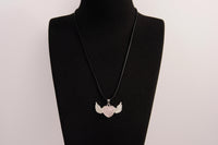 Raw Earth Crystals rose quartz heart with wings necklace, featuring a soft pink heart-shaped stone adorned with delicate angelic wings, designed to enhance love, compassion, and emotional healing.