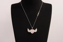 Raw Earth Crystals rose quartz heart with wings necklace, featuring a soft pink heart-shaped stone adorned with delicate angelic wings, designed to enhance love, compassion, and emotional healing.