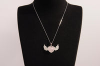 Raw Earth Crystals rose quartz heart with wings necklace, featuring a soft pink heart-shaped stone adorned with delicate angelic wings, designed to enhance love, compassion, and emotional healing.