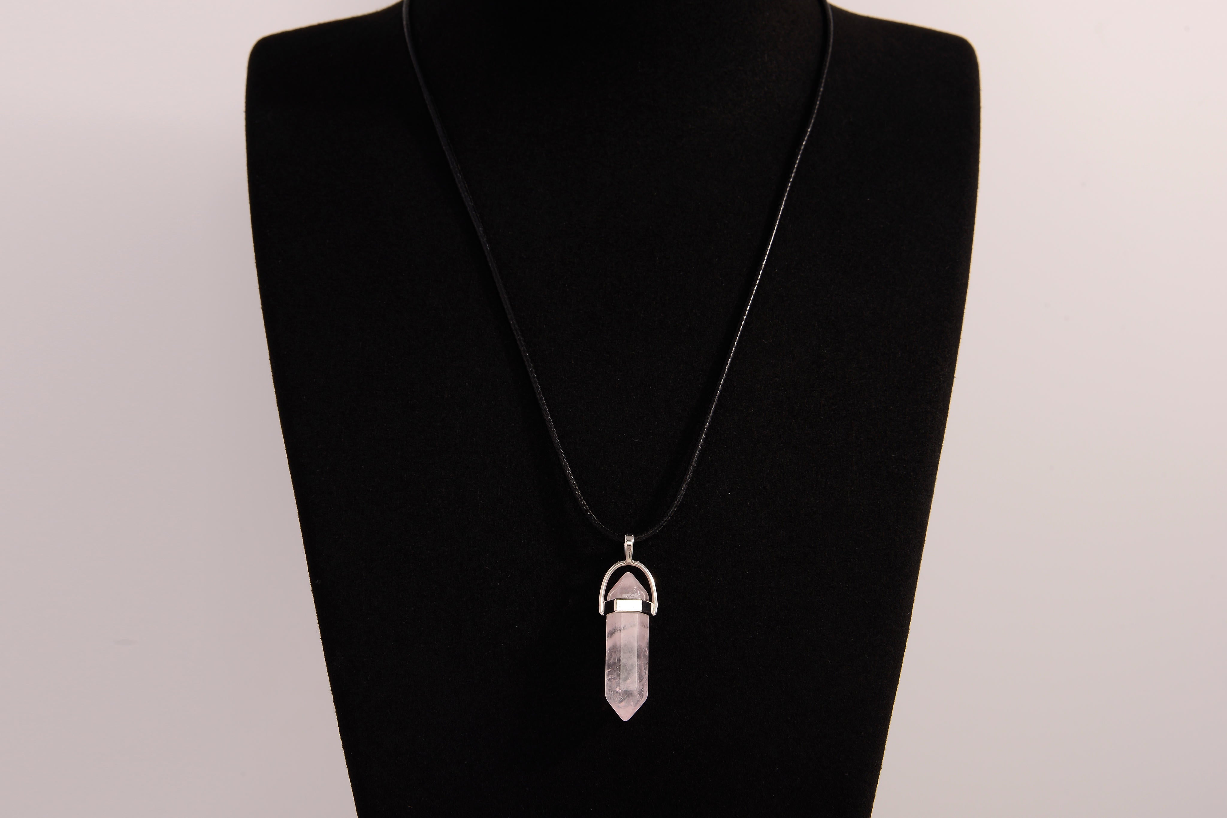 Raw Earth Crystals rose quartz necklace featuring a pointed natural stone pendant, designed to promote love, compassion, and emotional healing.