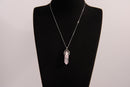 Raw Earth Crystals rose quartz necklace featuring a pointed natural stone pendant, designed to promote love, compassion, and emotional healing.