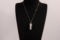 Raw Earth Crystals rose quartz necklace featuring a pointed natural stone pendant, designed to promote love, compassion, and emotional healing.