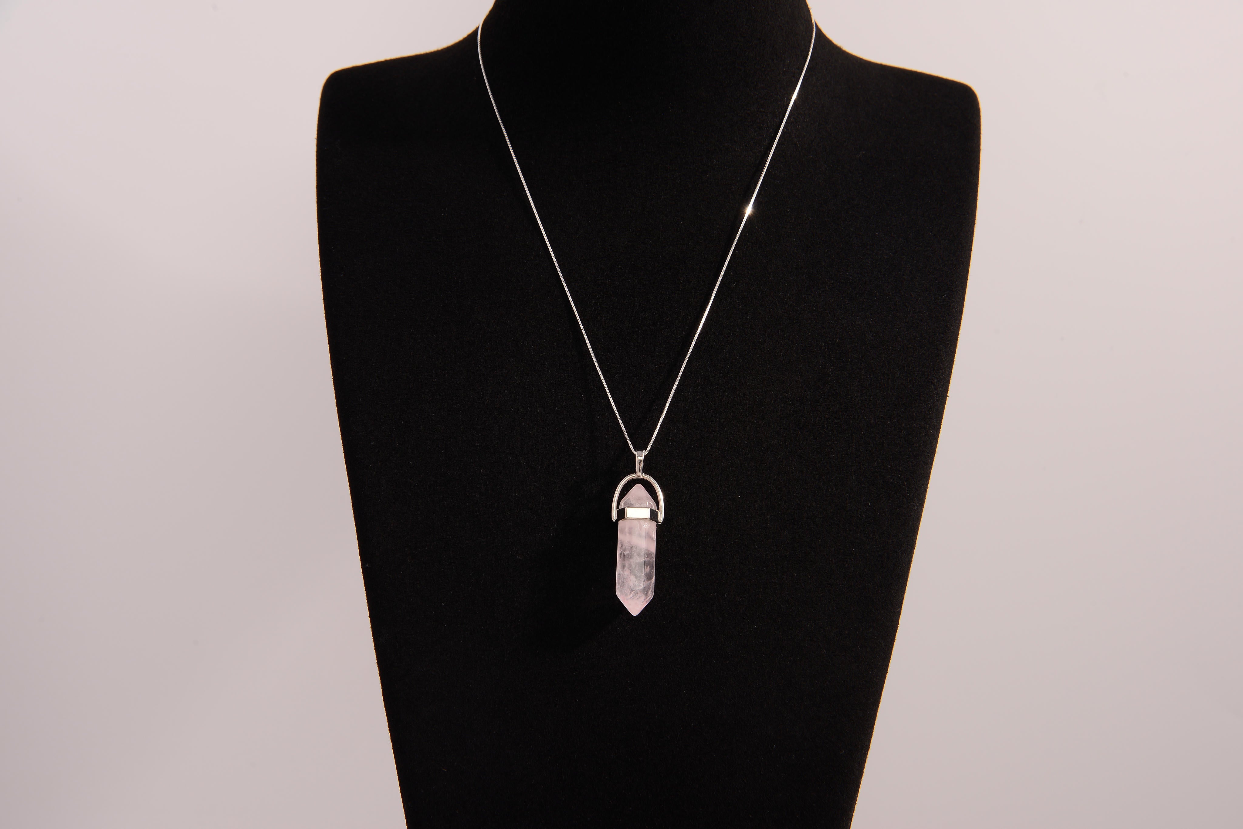 Raw Earth Crystals rose quartz necklace featuring a pointed natural stone pendant, designed to promote love, compassion, and emotional healing.