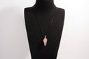 Raw Earth Crystals rose quartz pendant with a spiral wire wrap design, crafted from natural stone to foster love, compassion, and emotional healing.