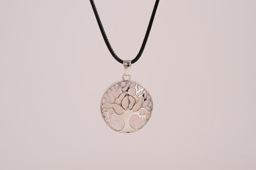 Raw Earth Crystals rose quartz pendant featuring a tree of life design, crafted with natural crystal for love, compassion, and emotional healing.