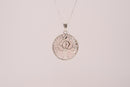 Raw Earth Crystals rose quartz pendant featuring a tree of life design, crafted with natural crystal for love, compassion, and emotional healing.