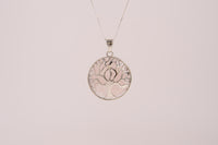 Raw Earth Crystals rose quartz pendant featuring a tree of life design, crafted with natural crystal for love, compassion, and emotional healing.