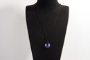 Raw Earth Crystals sodalite disc pendant necklace crafted from natural crystal for mental clarity, communication, and emotional balance.