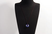 Raw Earth Crystals sodalite disc pendant necklace crafted from natural crystal for mental clarity, communication, and emotional balance.