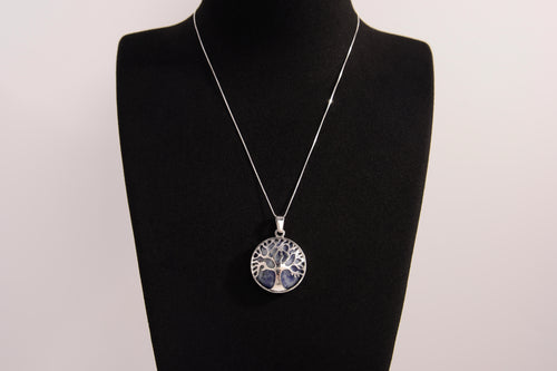 Raw Earth Crystals sodalite pendant featuring a tree of life design, crafted with natural crystal for mental clarity, inner peace, and spiritual connection.