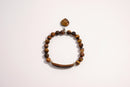 Raw Earth Crystals tiger eye bracelet with raw stone accent, crafted from natural crystal, promotes confidence, protection, and mental clarity.