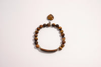 Raw Earth Crystals tiger eye bracelet with raw stone accent, crafted from natural crystal, promotes confidence, protection, and mental clarity.