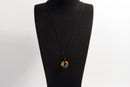Raw Earth Crystals tiger eye disc pendant necklace made with natural crystal for confidence, focus, and protection.