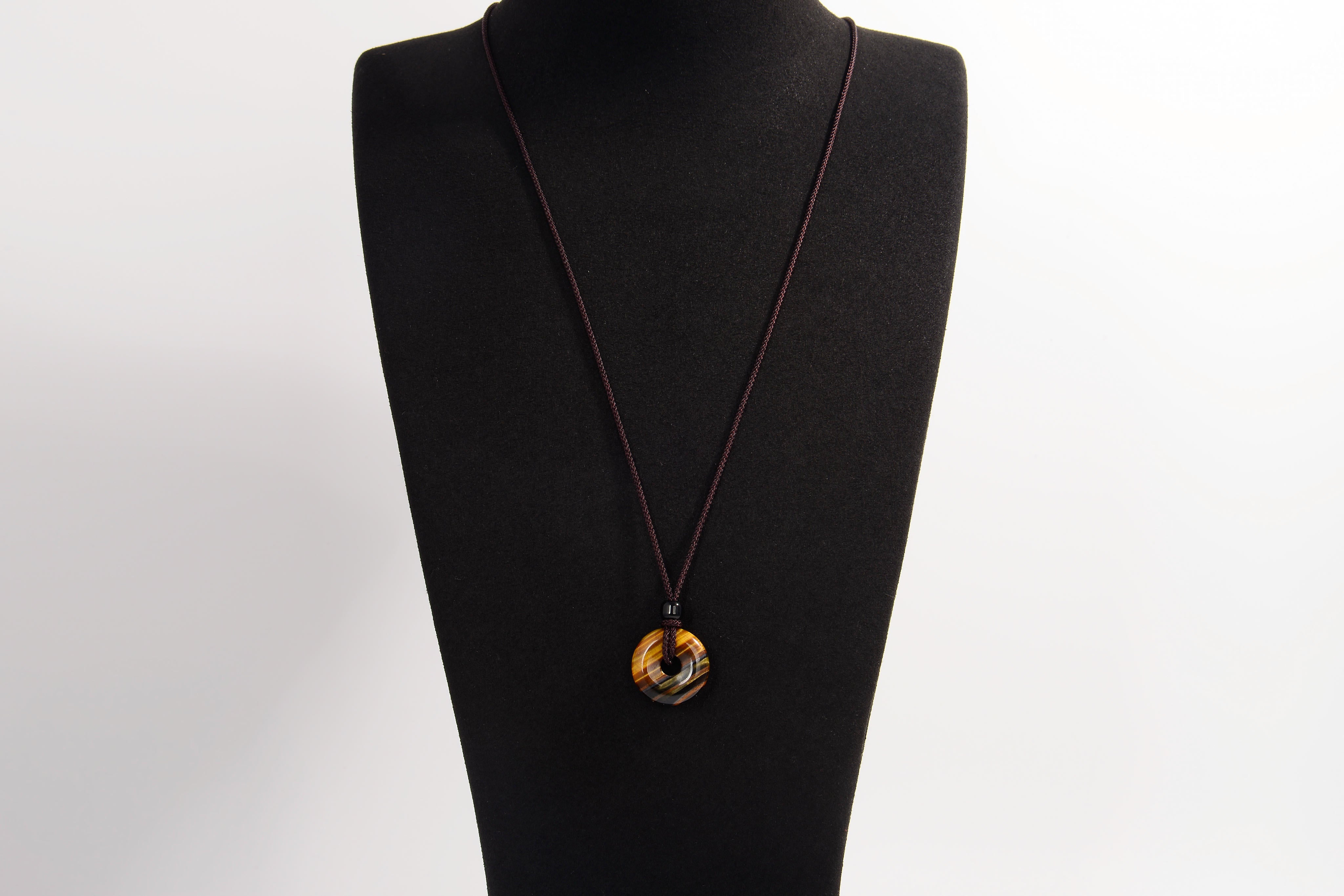 Raw Earth Crystals tiger eye disc pendant necklace made with natural crystal for confidence, focus, and protection.