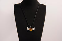 Raw Earth Crystals tiger eye heart with wings necklace, featuring a rich golden-brown heart-shaped stone adorned with delicate angelic wings, designed to enhance confidence, promote clarity, and support personal empowerment.