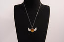 Raw Earth Crystals tiger eye heart with wings necklace, featuring a rich golden-brown heart-shaped stone adorned with delicate angelic wings, designed to enhance confidence, promote clarity, and support personal empowerment.