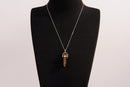 Raw Earth Crystals tiger eye necklace with a pointed natural stone pendant, designed to boost confidence, provide protection, and enhance mental clarity.