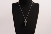 Raw Earth Crystals tiger eye necklace with a pointed natural stone pendant, designed to boost confidence, provide protection, and enhance mental clarity.