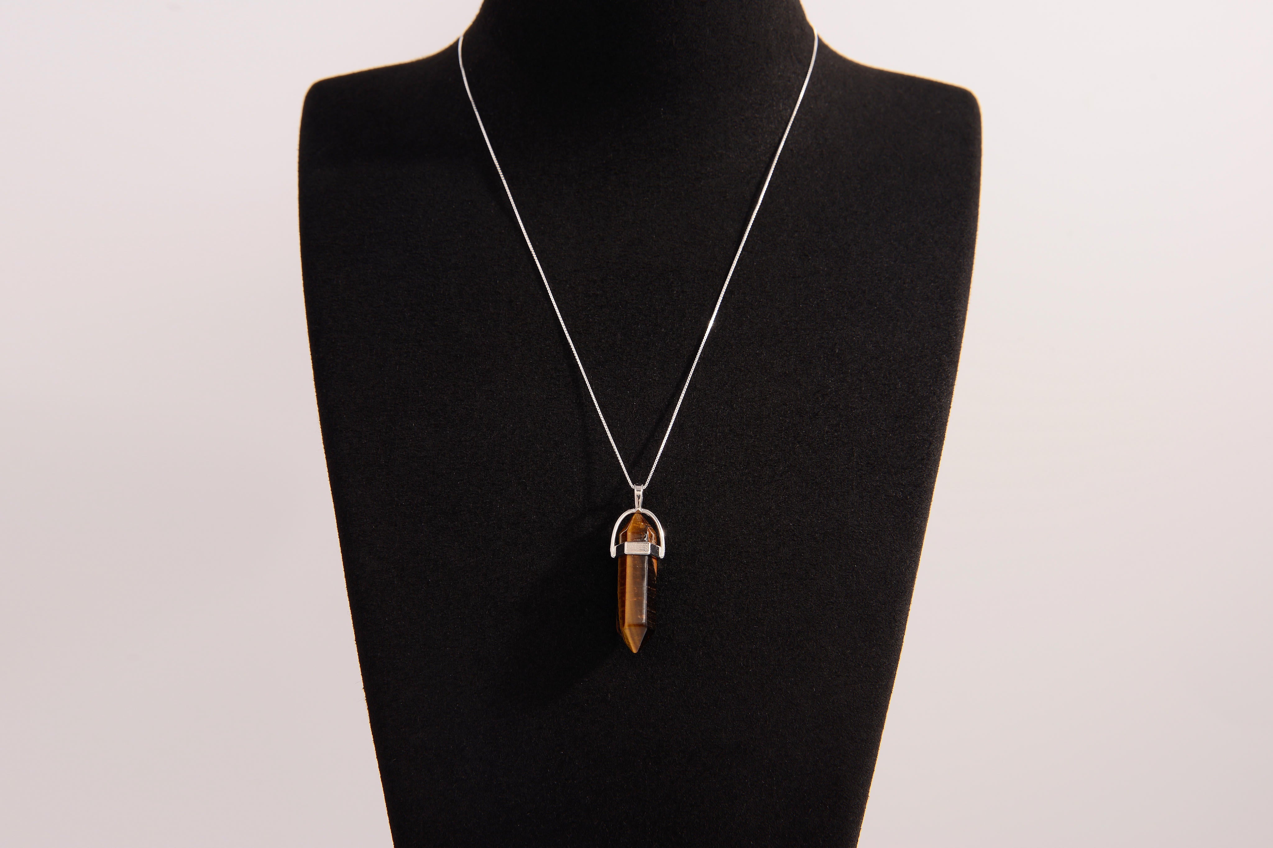 Raw Earth Crystals tiger eye necklace with a pointed natural stone pendant, designed to boost confidence, provide protection, and enhance mental clarity.