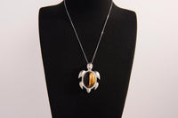 Raw Earth Crystals tiger eye turtle necklace crafted from natural stone to boost courage, focus, and personal power with grounding energy.