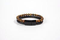 Raw Earth Crystals tiger eye and onyx bracelet with braided leather design, made from natural crystals, promotes confidence, protection, and grounding energy.