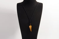 Raw Earth Crystals tiger eye point pendant necklace featuring natural crystal jewelry designed for confidence, focus, and personal power.