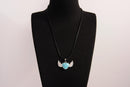Raw Earth Crystals turquoise heart with wings necklace, featuring a vibrant blue-green heart-shaped stone adorned with delicate angelic wings, designed to promote communication, emotional balance, and spiritual protection.