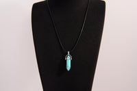 Raw Earth Crystals turquoise necklace featuring a pointed natural stone pendant, designed to promote communication, enhance intuition, and support emotional healing.