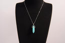 Raw Earth Crystals turquoise necklace featuring a pointed natural stone pendant, designed to promote communication, enhance intuition, and support emotional healing.